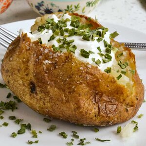 Martha Stewart's Secret Ingredients For Heavenly Baked Potatoes